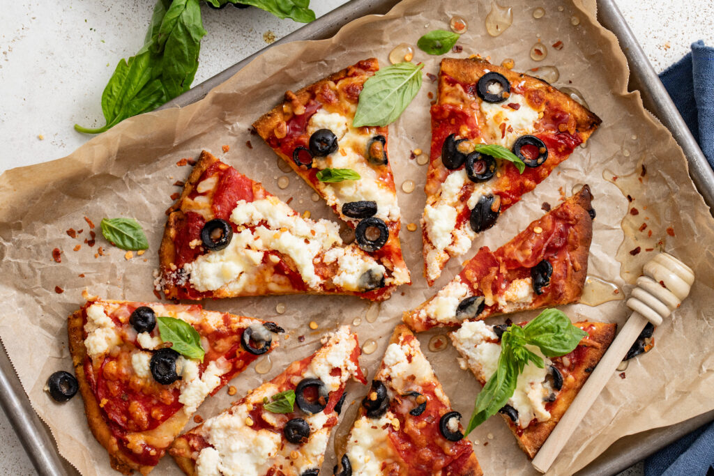 Pepperoni, Ricotta & Olive Naan Flatbread with Spicy Honey - Alberta Milk